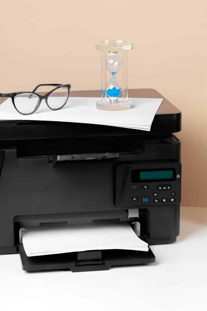 printer with glasses and sand timer